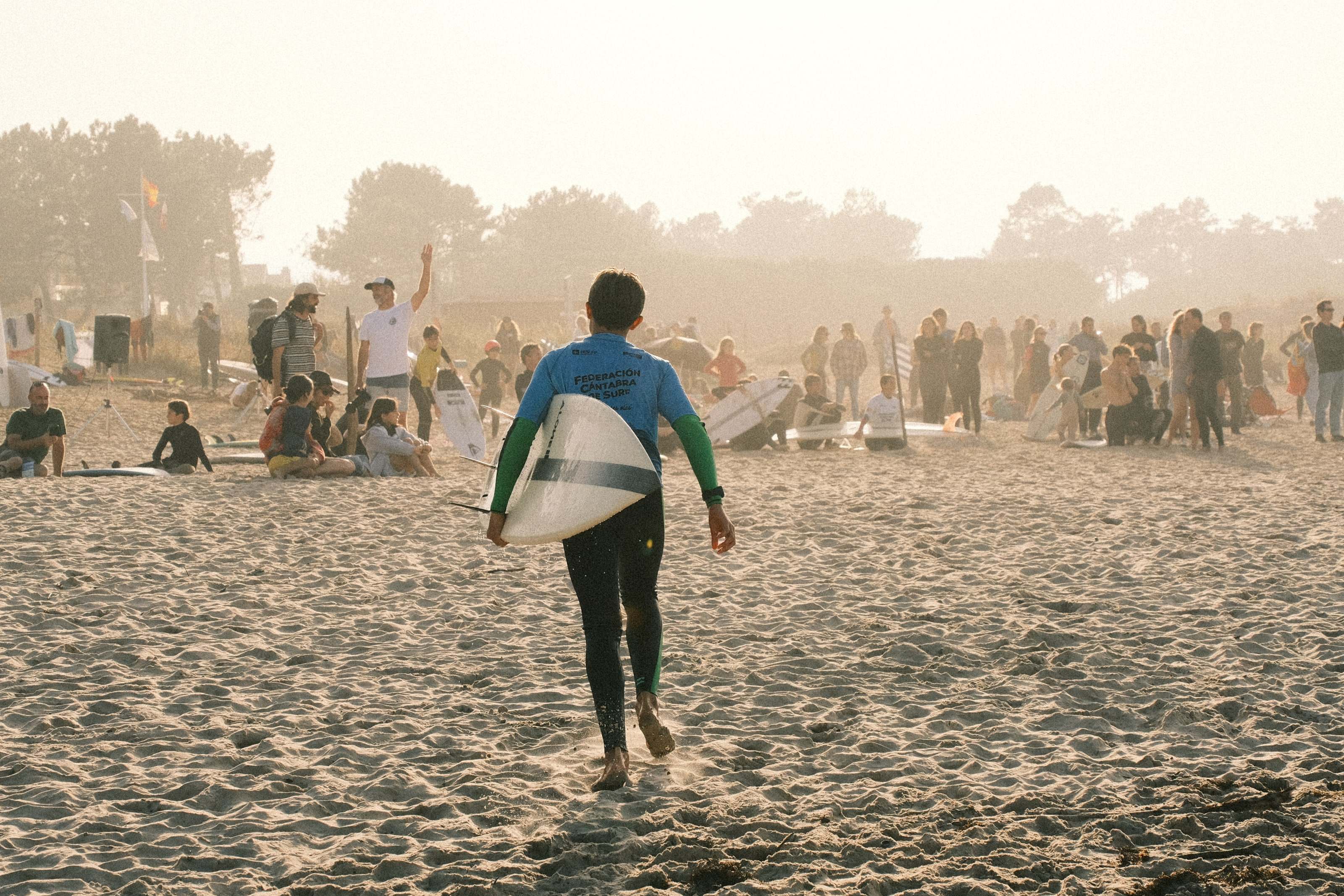 Competitor walking up the beach towards the crowd after a heat